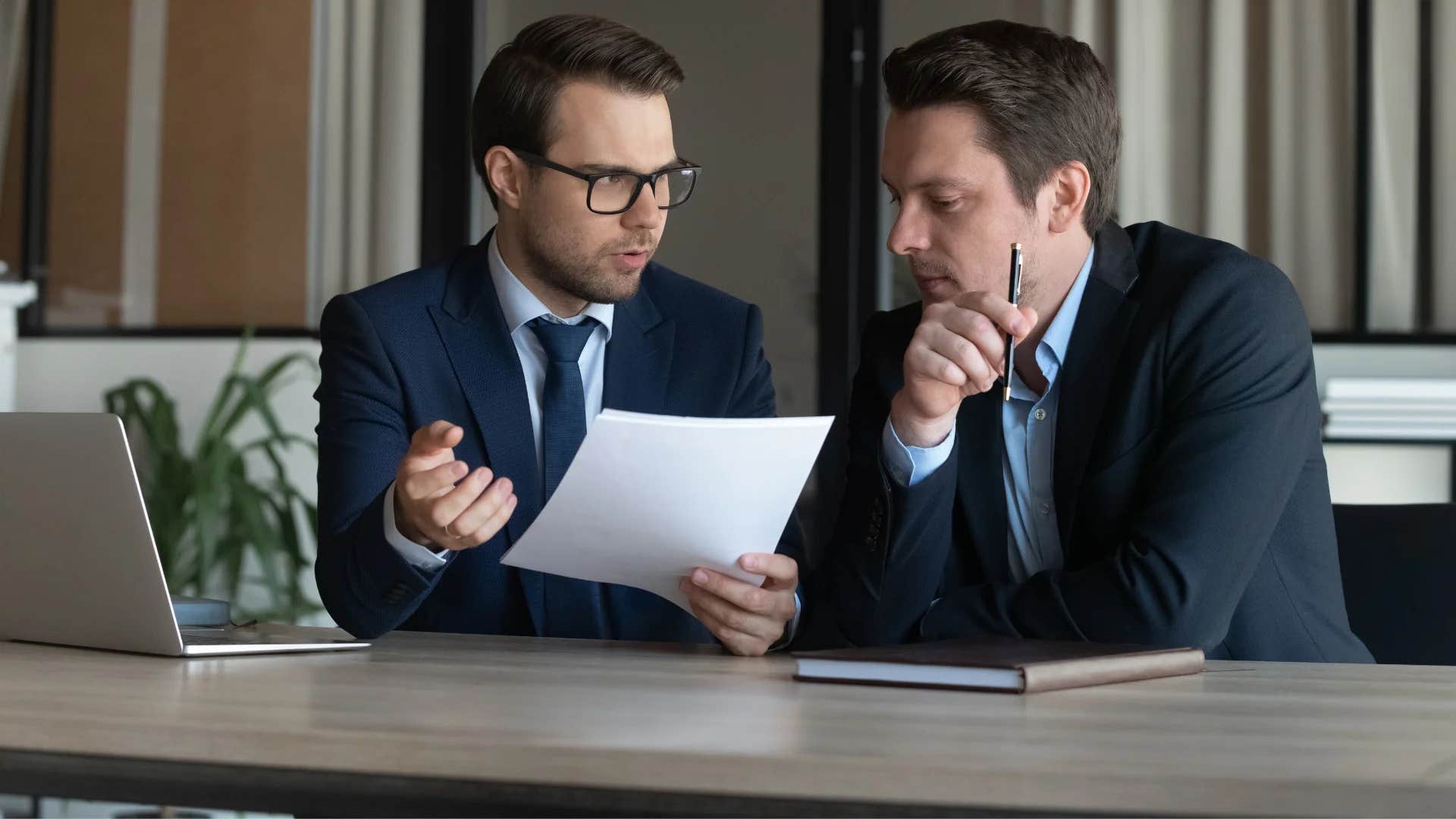 professional man telling colleague saying sorry i'm a bit low on time what's the main issue here