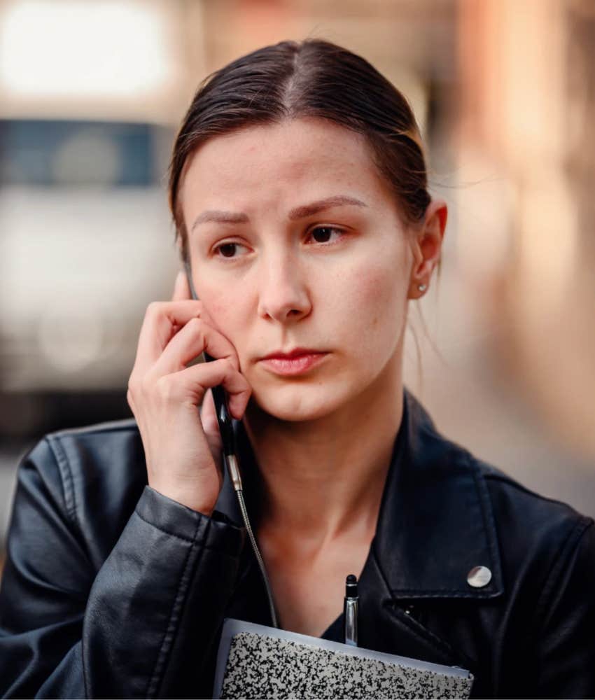 unsuccessful woman looks miserable on the phone outdoors