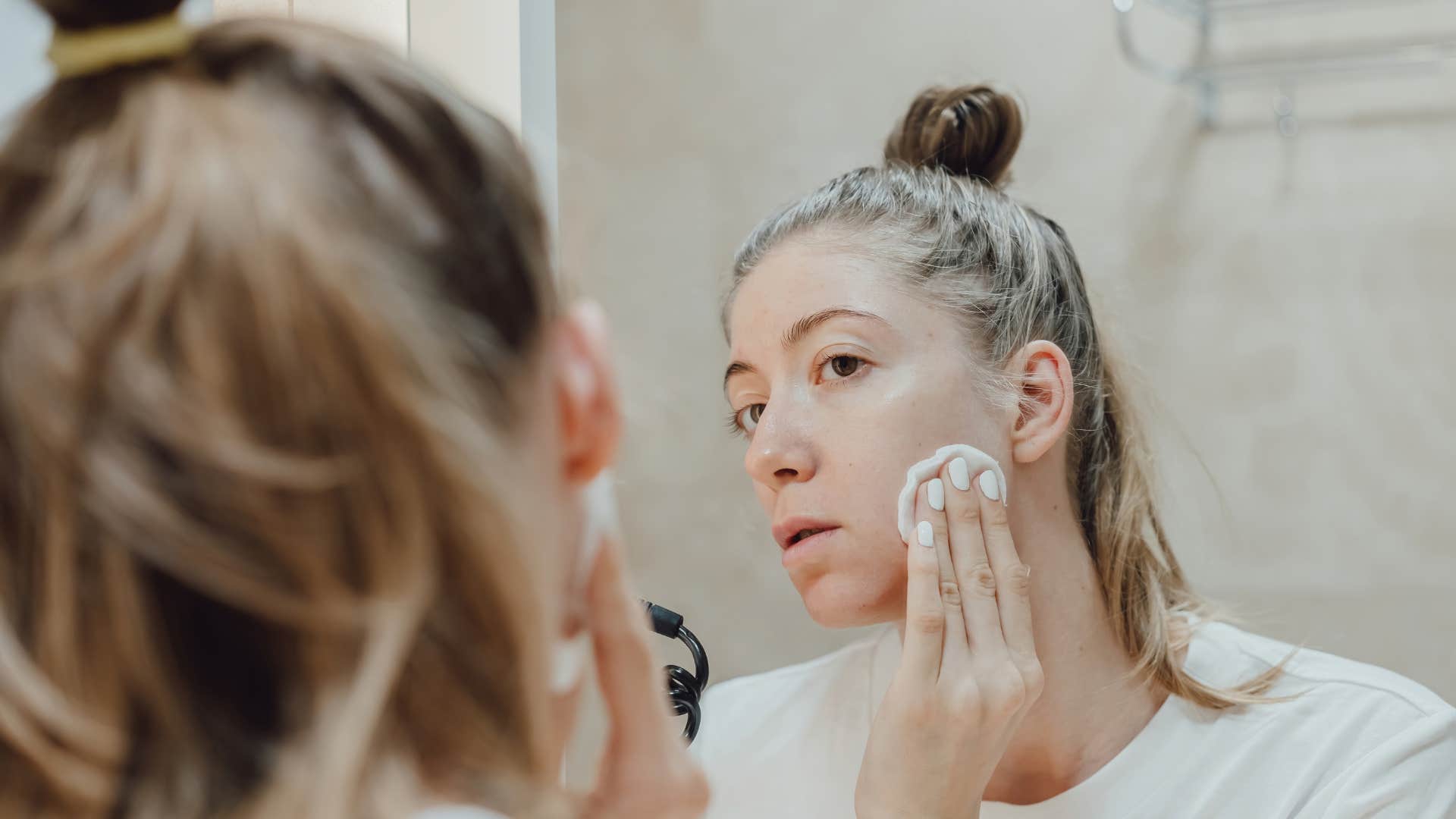 woman with a strict bedtime routine washing face is a comfort setting from childhood