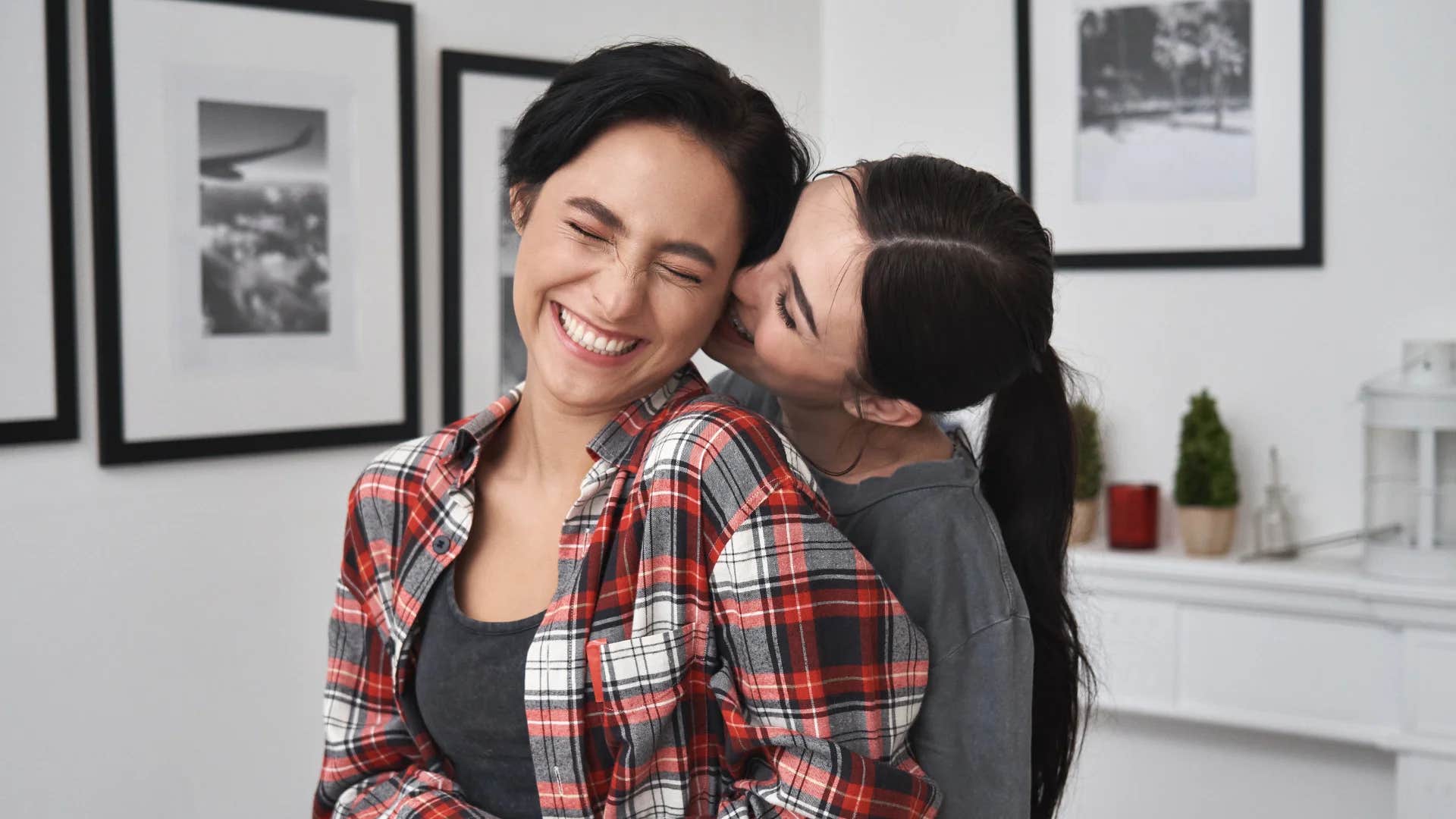 woman who isn't actually happy with woman saying i can't be happy if you're not happy