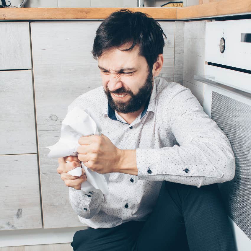 high-iq man getting easily frustrated crumpling paper