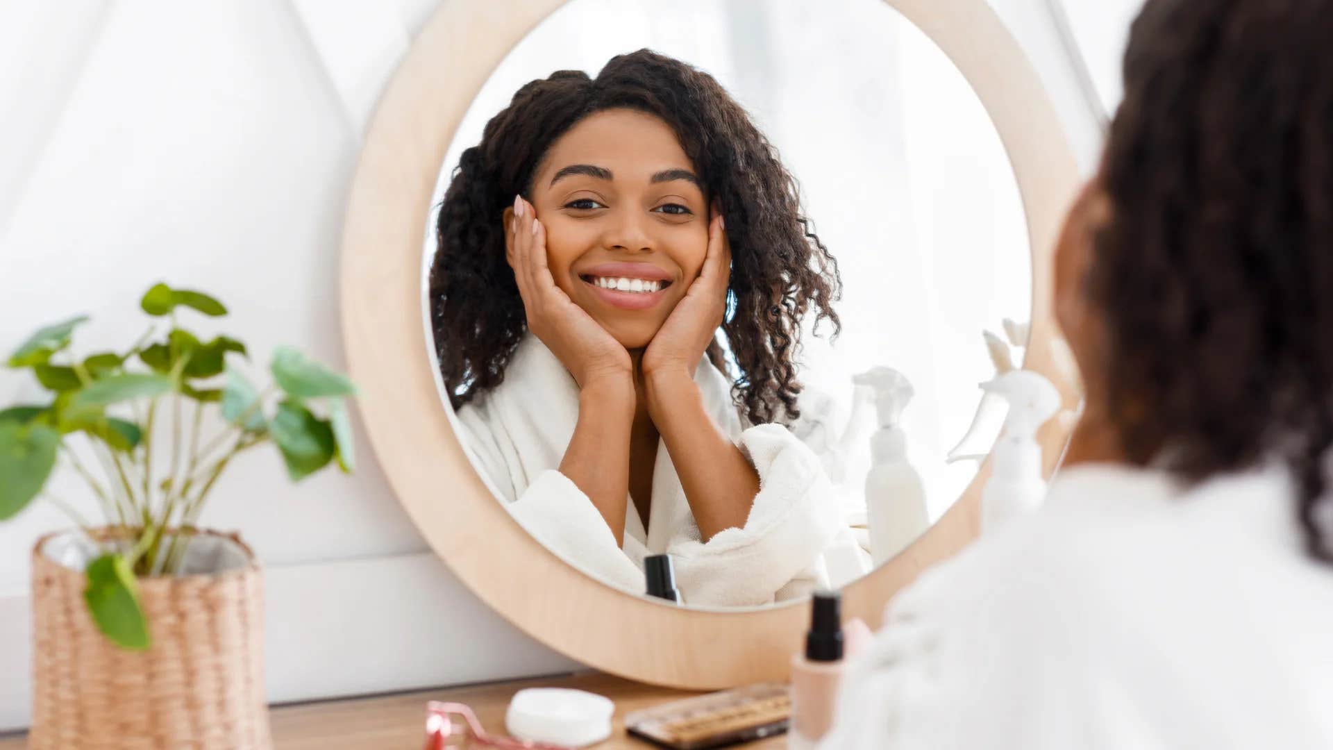 deeply charismatic woman telling herself i am beautiful inside and out