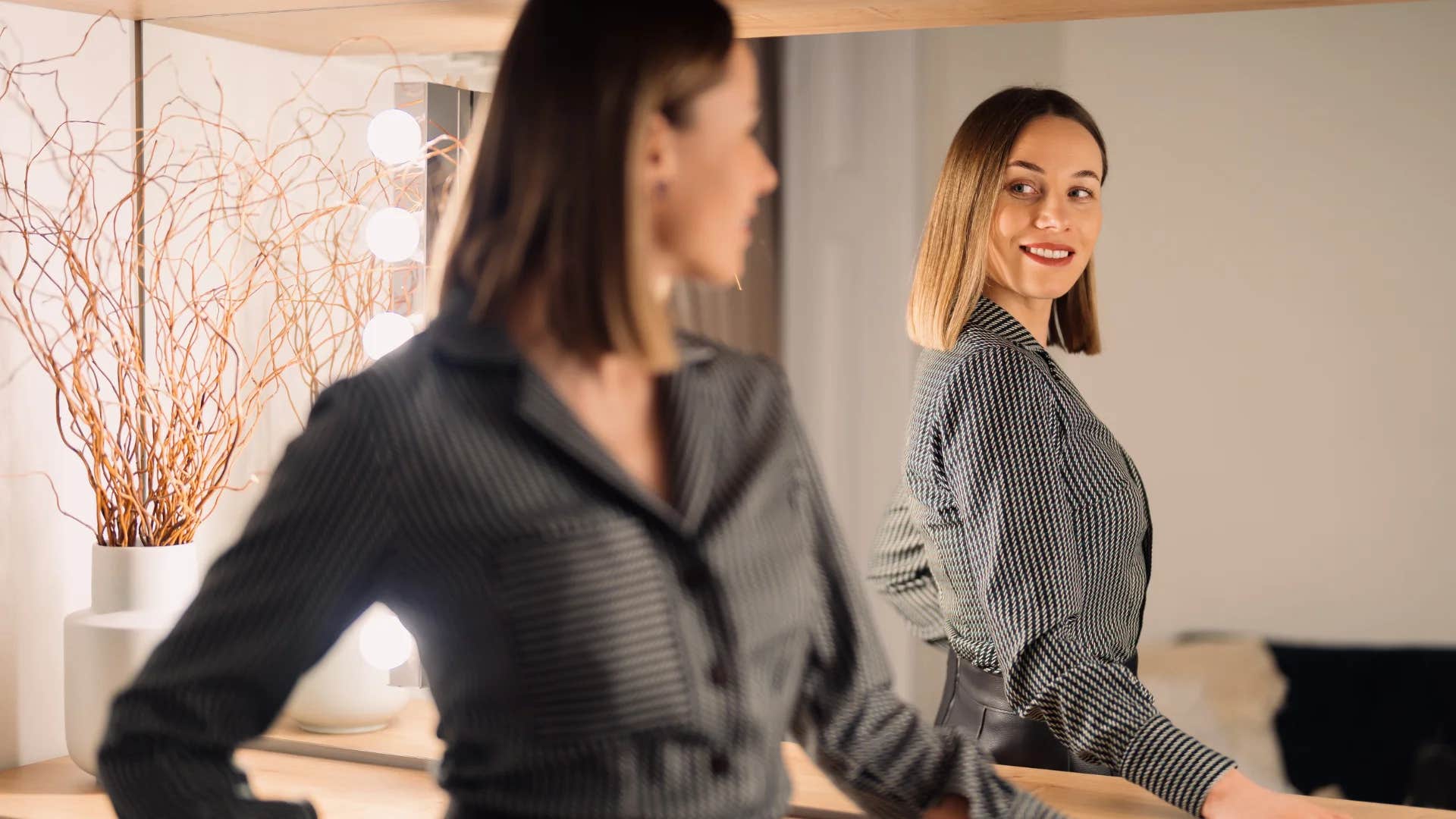 deeply charismatic woman telling herself every day i fall more and more in love with myself