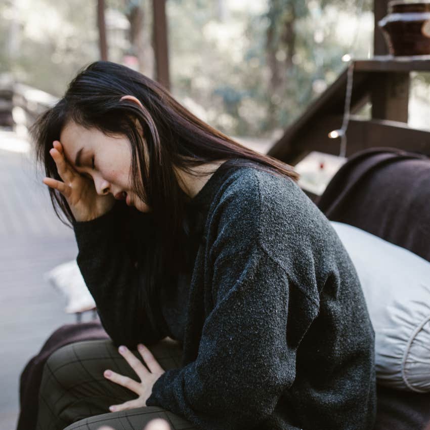 deeply sad woman saying don't worry about it