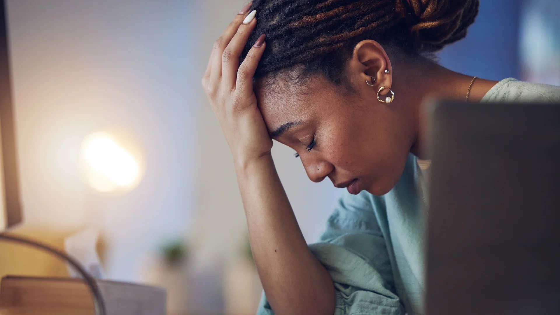 stressed millennial woman sick of wasting time at work