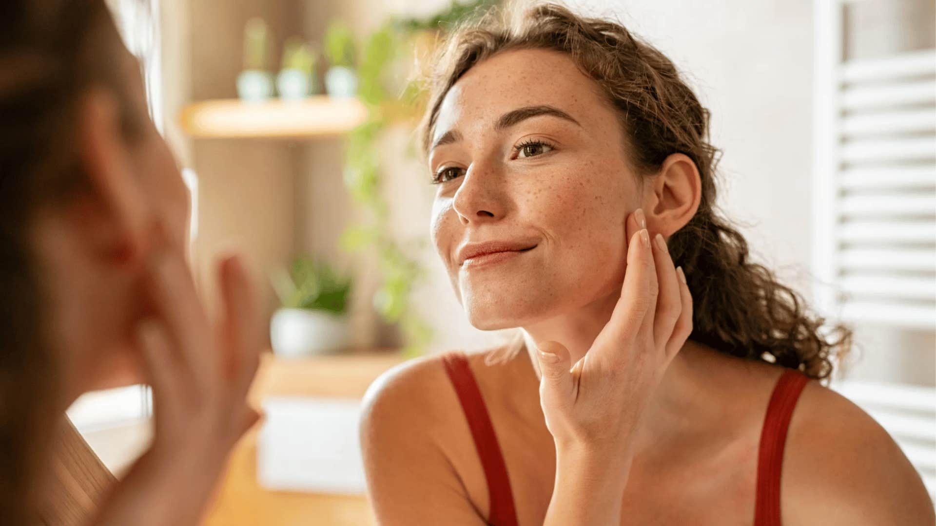 millennial woman doing her skincare routine on natural face