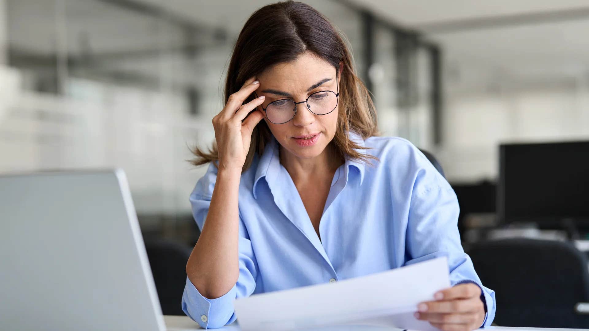 older millennial woman ignoring her uncertainty at work