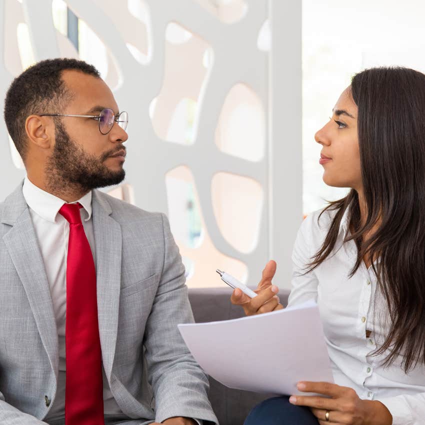 woman telling colleague she's not gossiping saying telephone rarely ends well