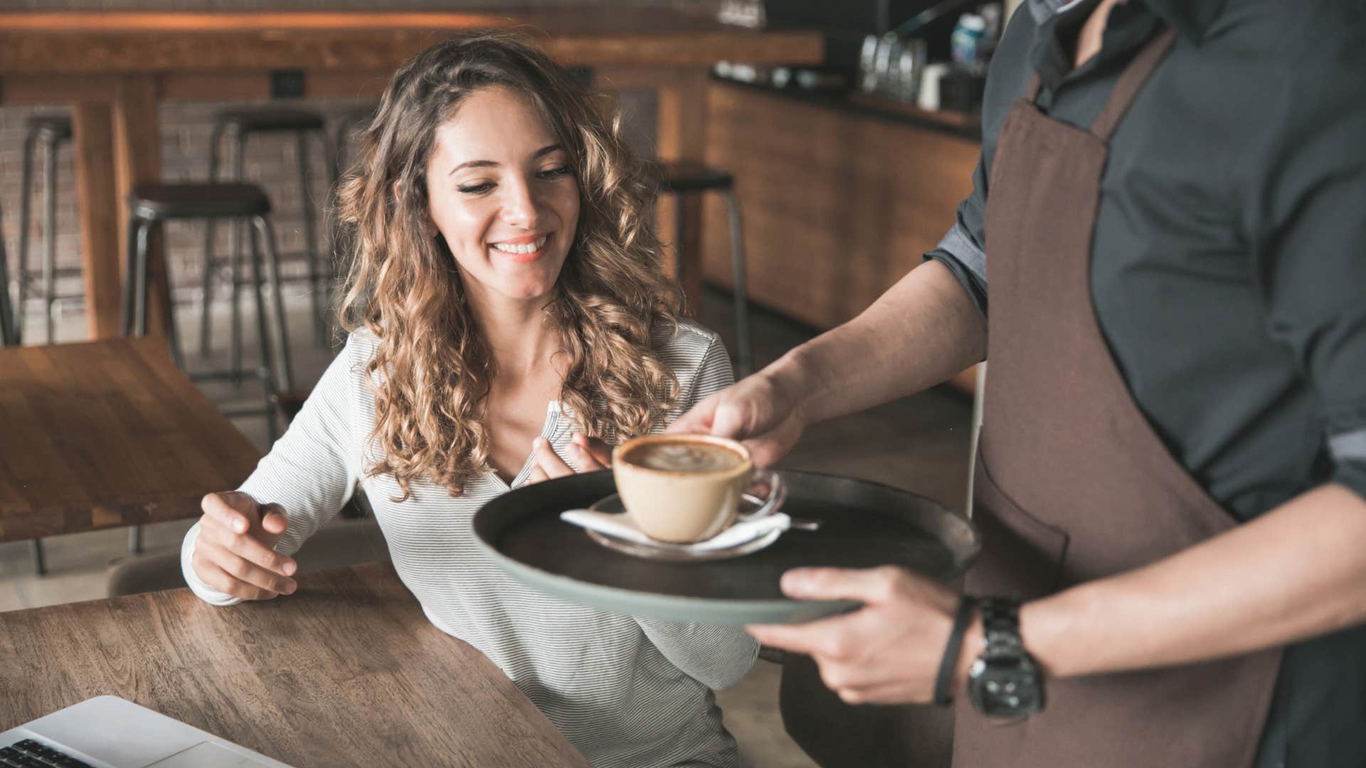 woman who dreads a quiet sunday getting her favorite coffee at a local cafe