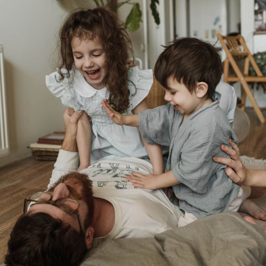 evolved nest parent playing happily with his children