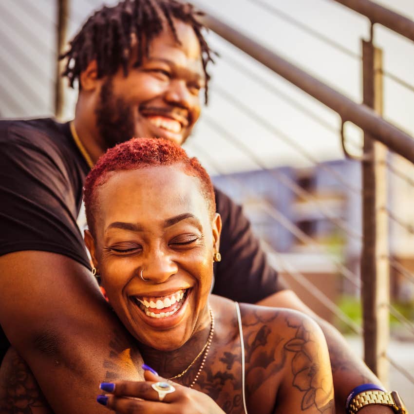 happy couple laughing together naturally