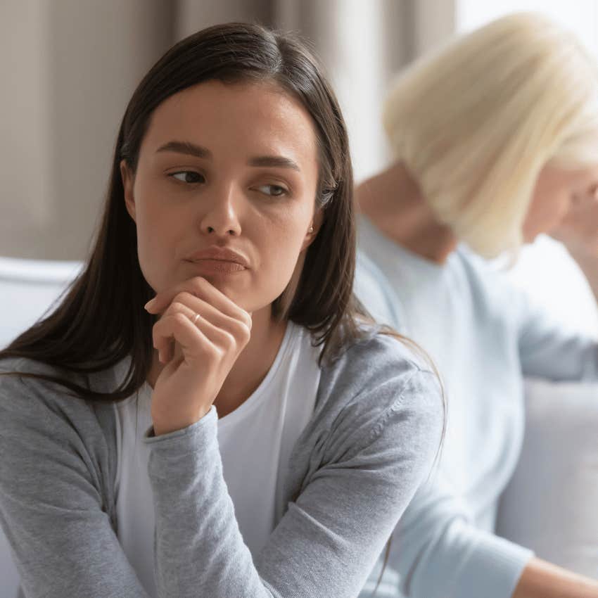 young woman annoying older woman by saying major w