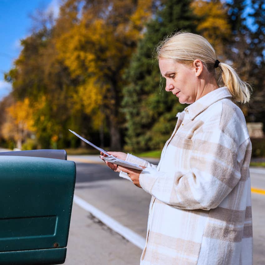 Gen X woman using a drop box to send her mail