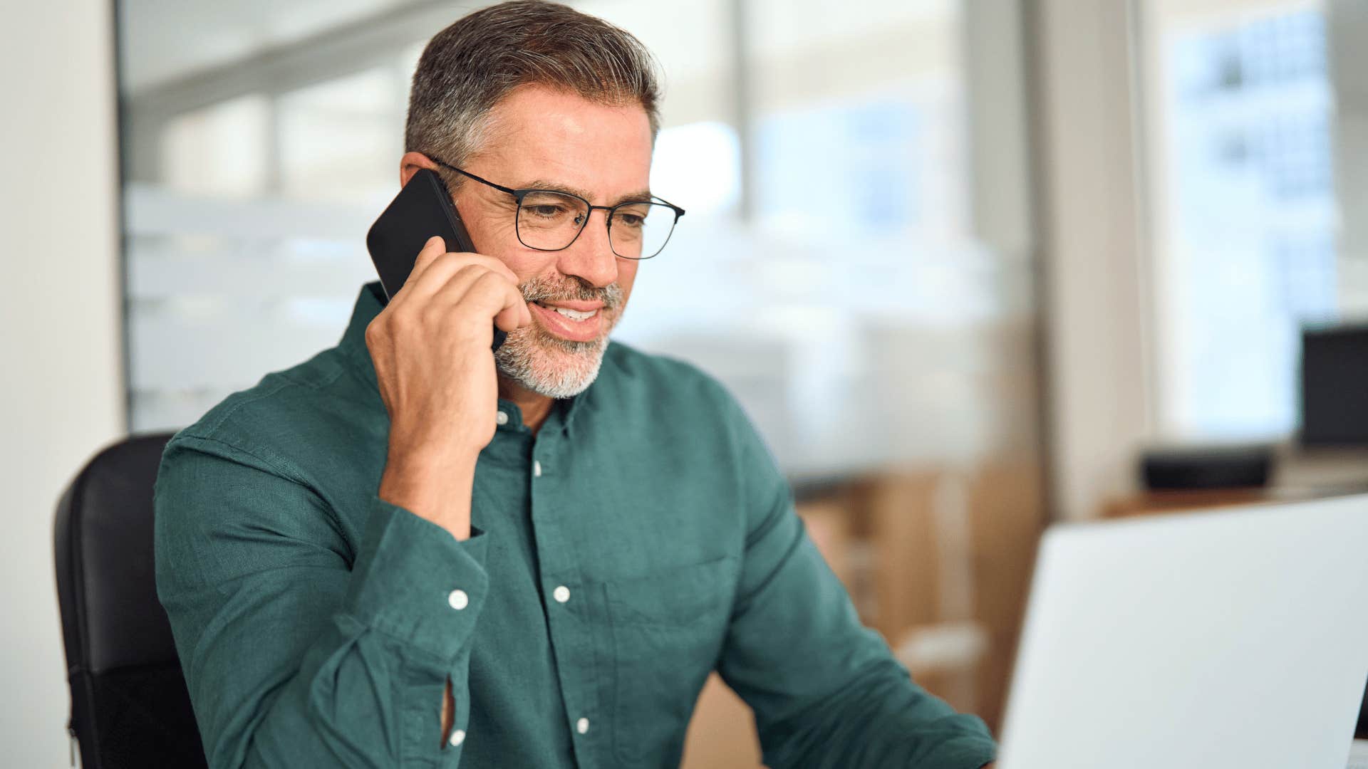 man scheduling an appointment on the phone confidently