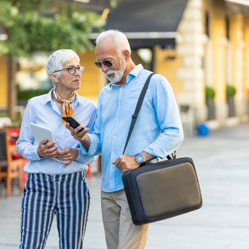boomer couple dressed up and walking around
