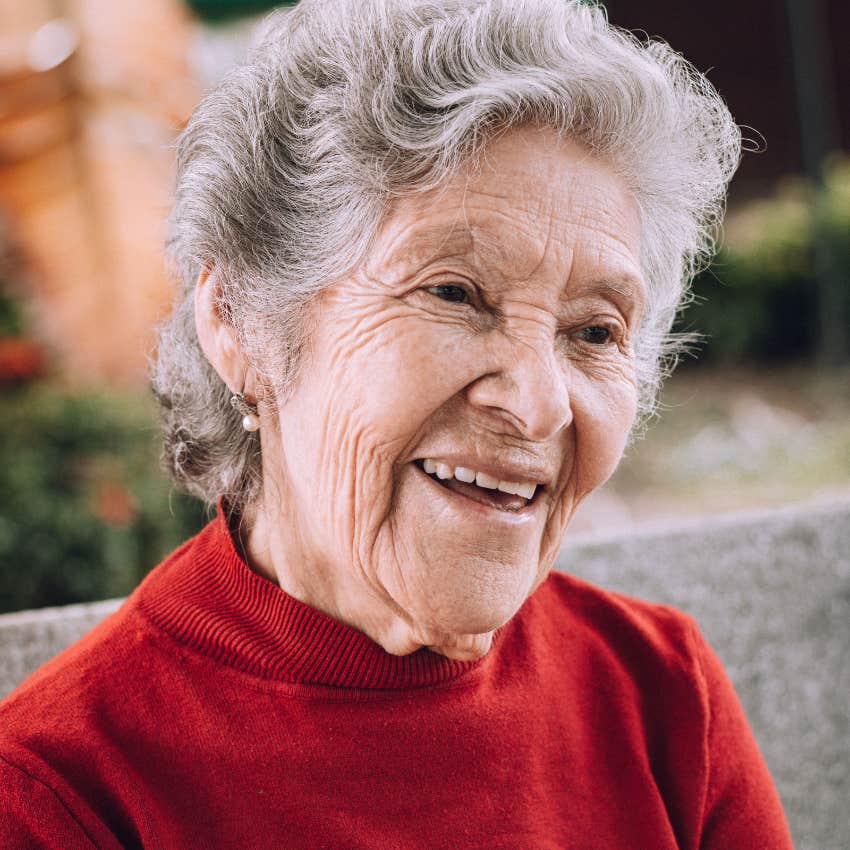 boomer woman smiling looking off frame