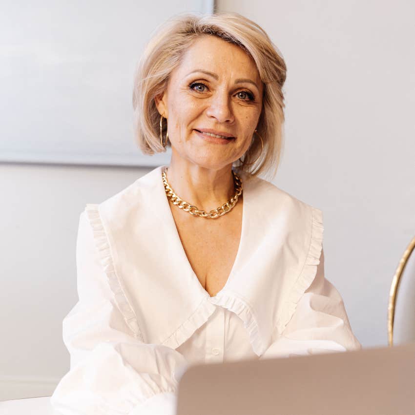 successful gen X woman working on her laptop