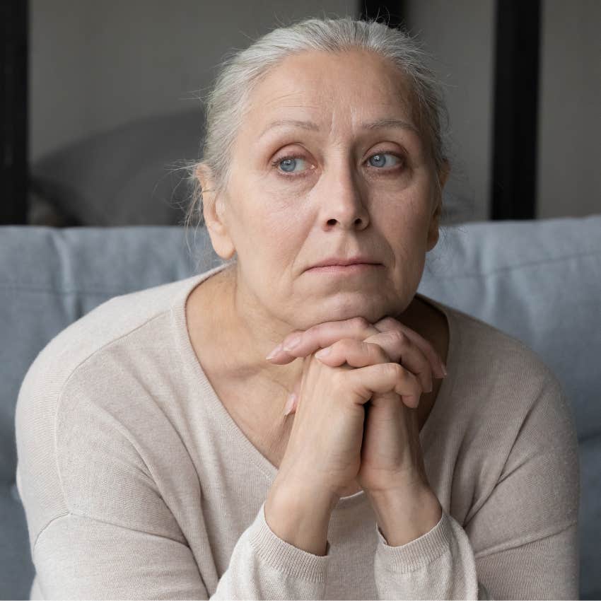 boomer woman sitting home bored on halloween not wanting to celebrate