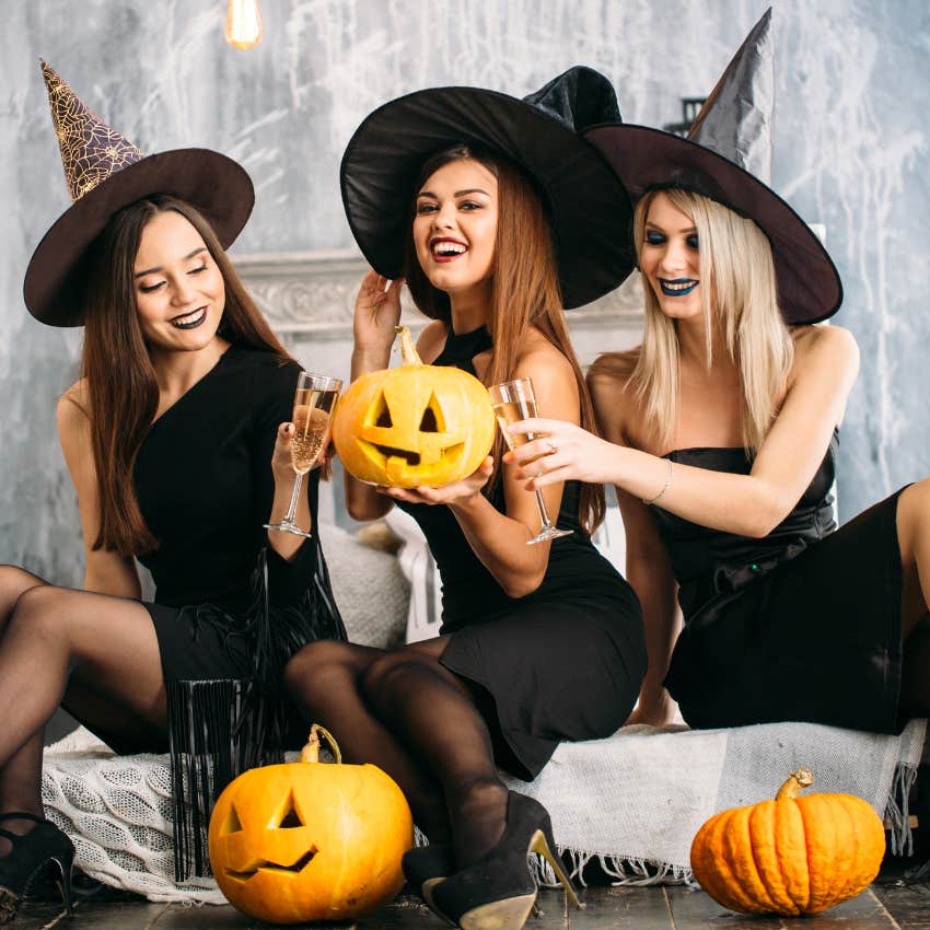 group of gen z friends dressed up for halloween holding pumpkins