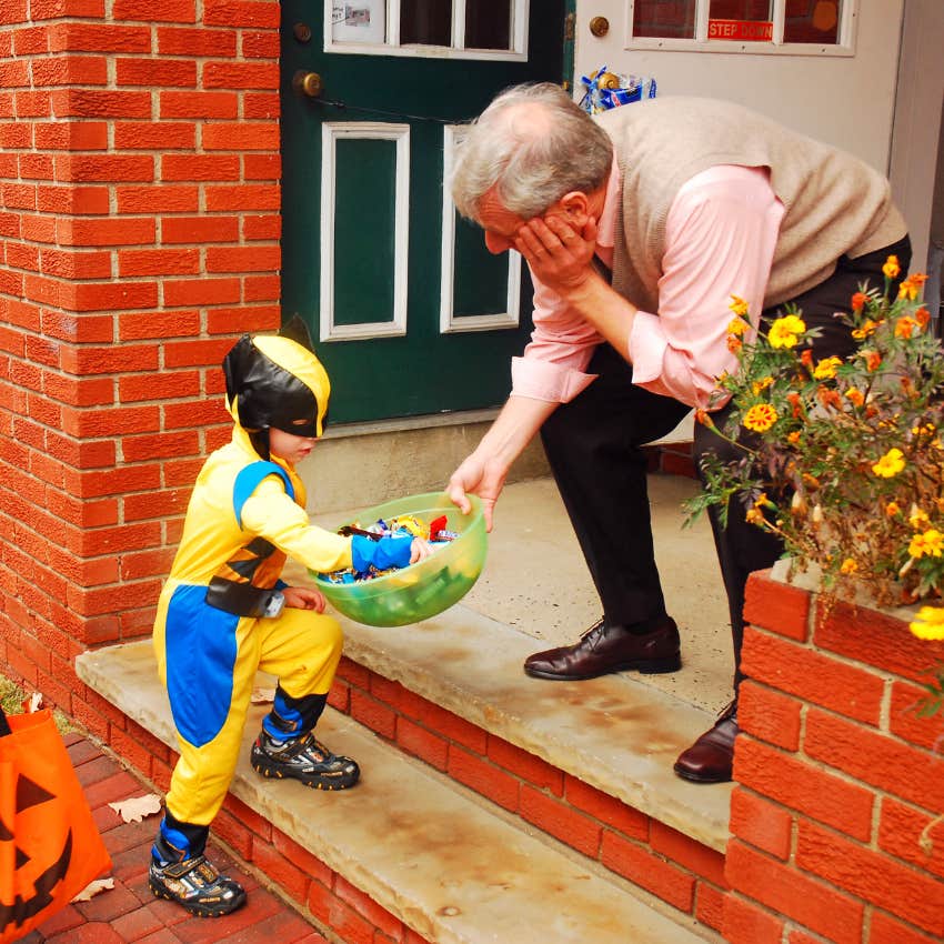 boomer man handing out candy to little boy on halloween thinks kids between 11 and 12 are too old to trick-or-treat
