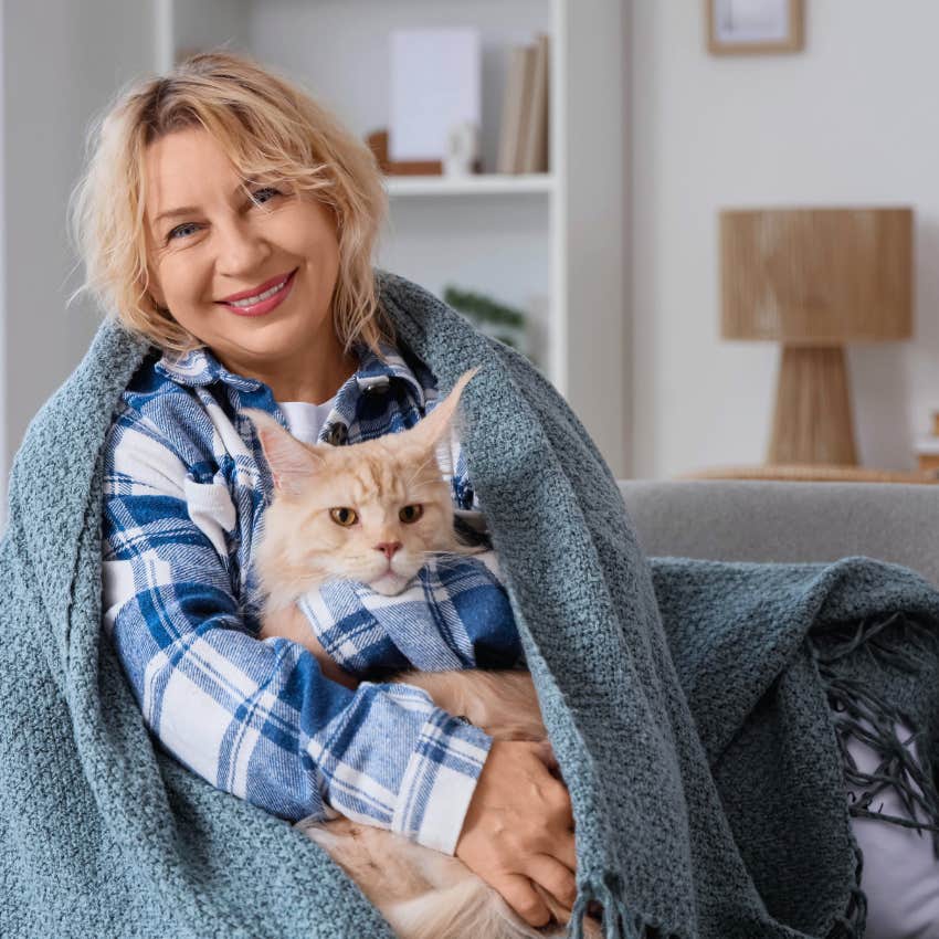 gen x woman who treats her cat well by spending money on it