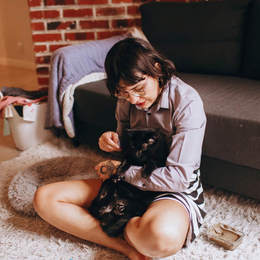 millennial woman who treats her cat like part of her family