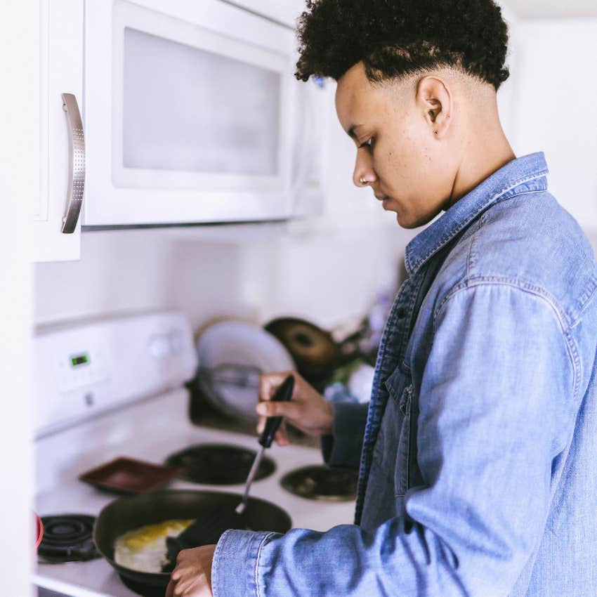 millennial man making a home-cooked meal