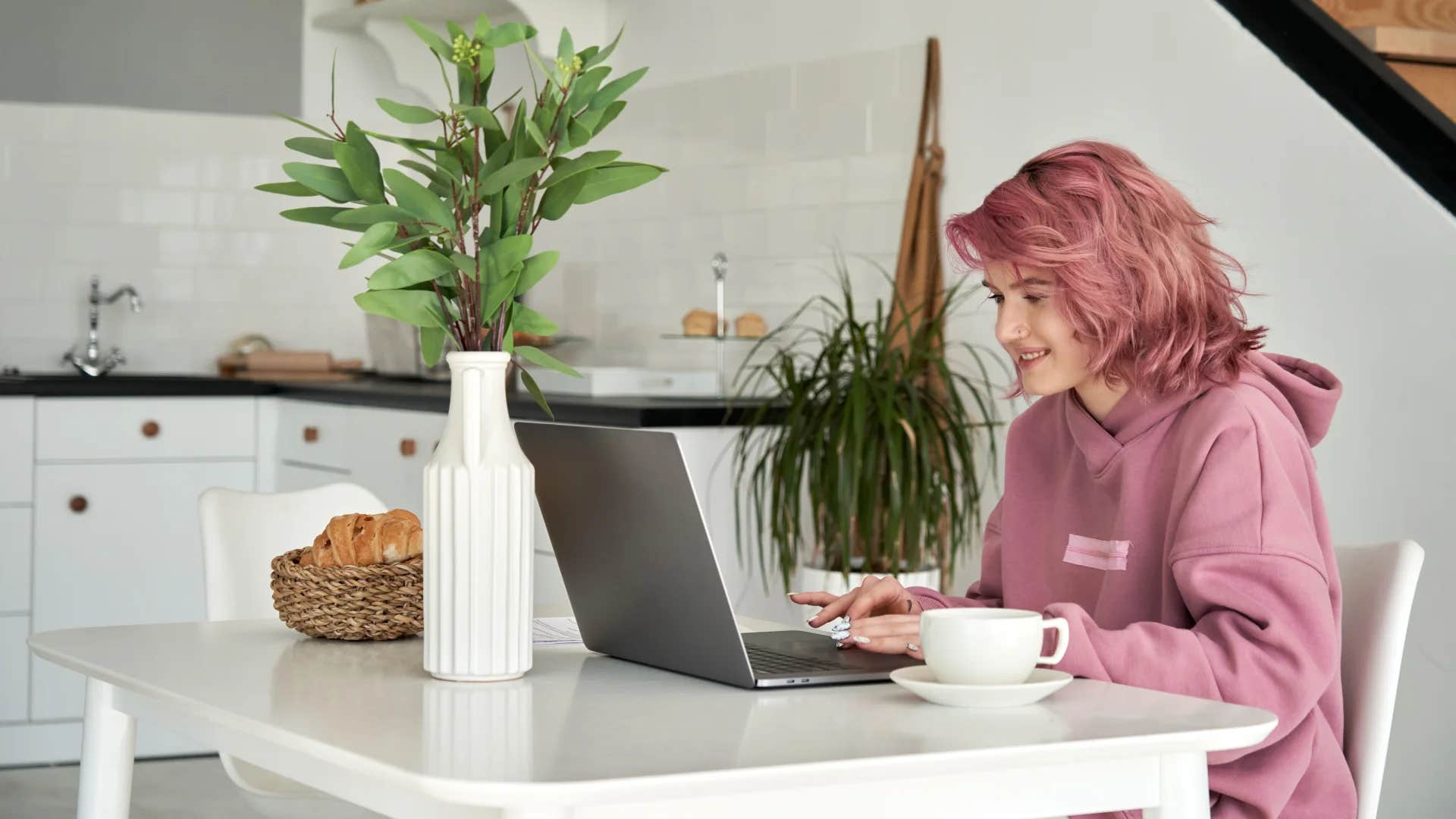 gen Z woman using AI to get her work done at home