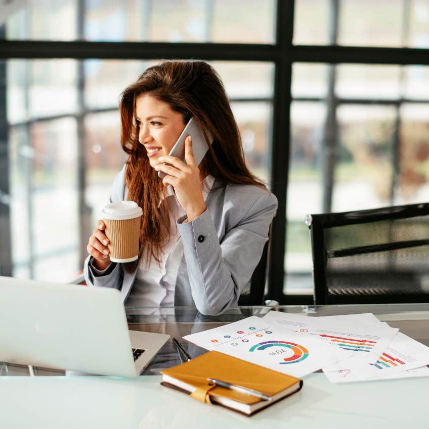 Gen Z woman pretending to be busy at work