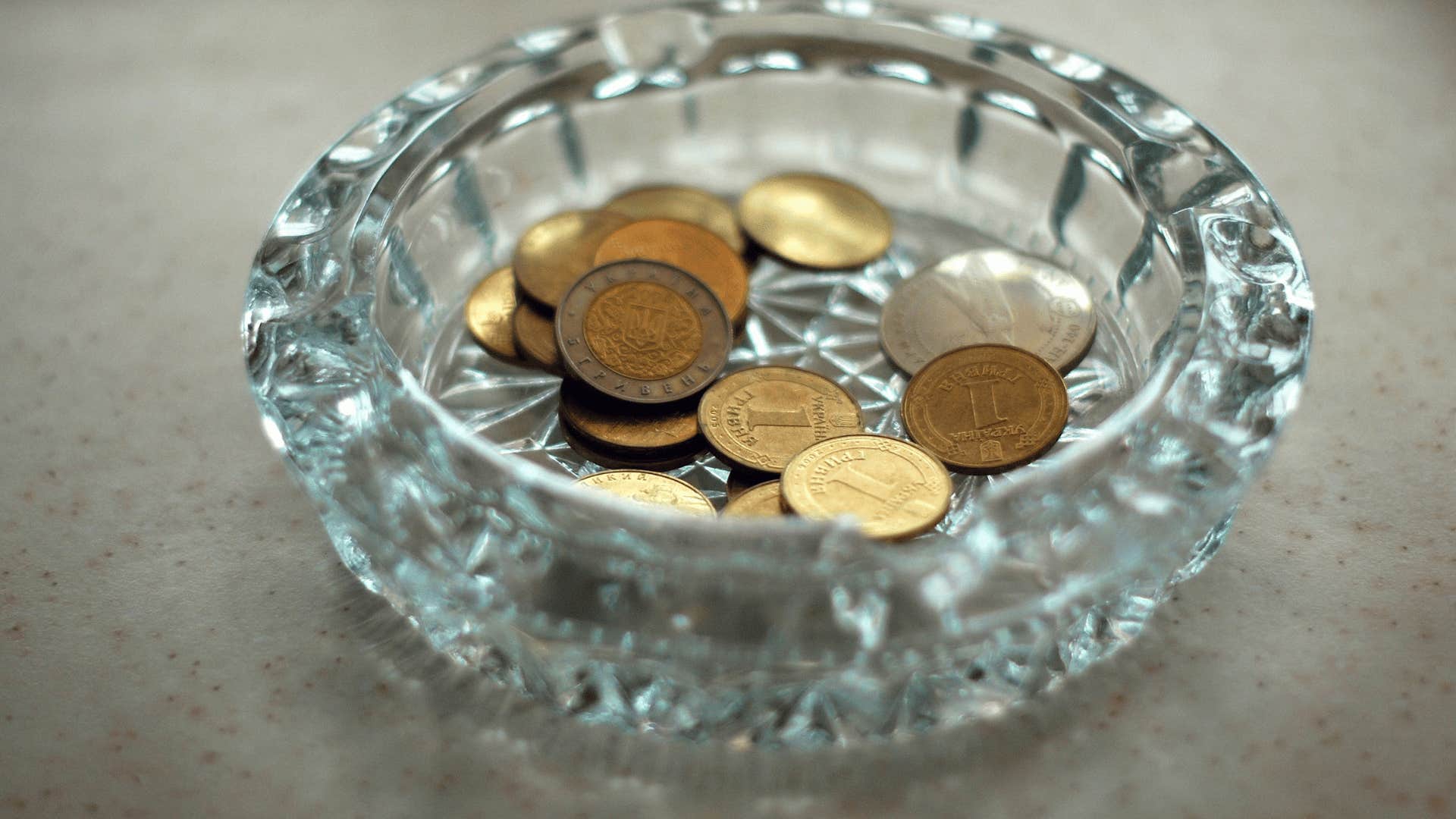 ashtray being used as a coin holder