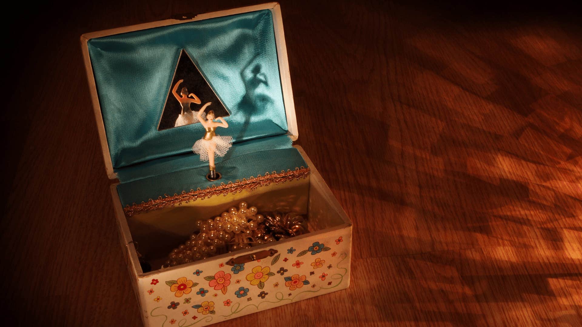 music box of a ballerina dancing on the dresser