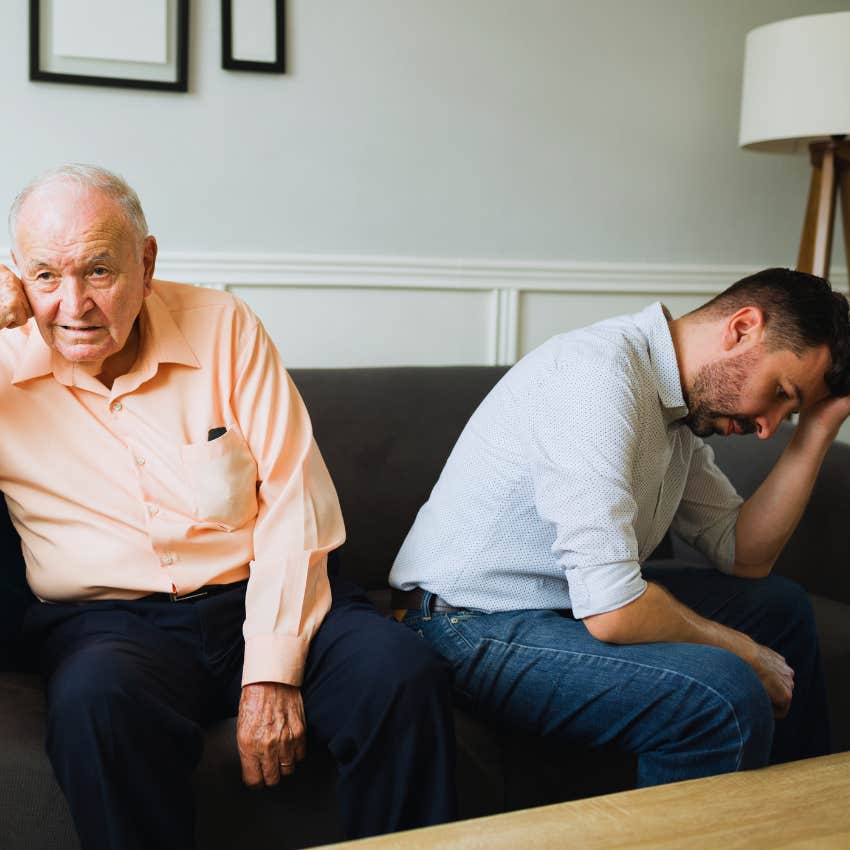 man turned away from his father who seems unkind 