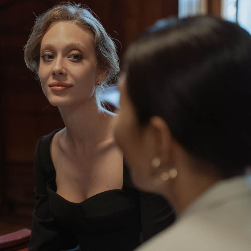 confident woman not listening to colleague's judgments about her