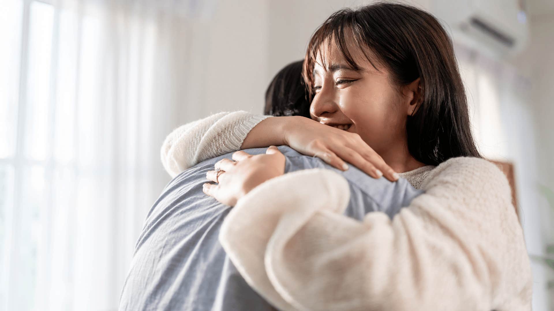 couple hugging as man tries to rush relationship