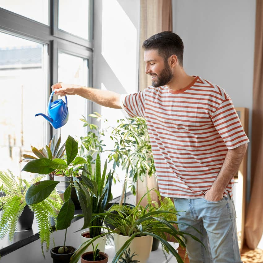 man who feels behind in life caring for houseplants