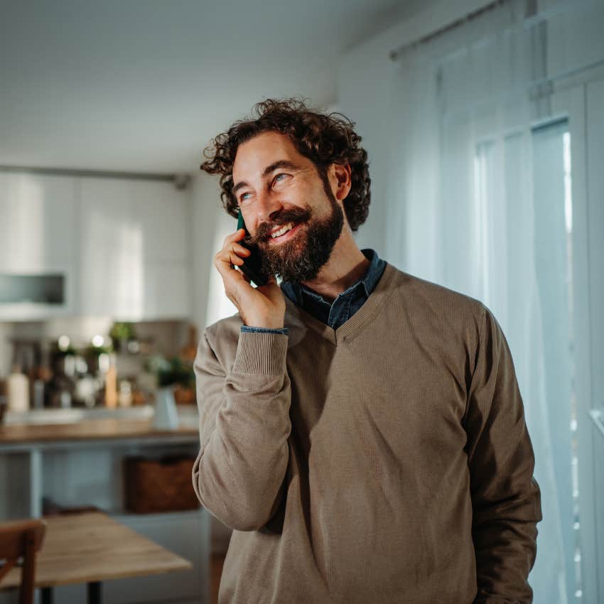 man who hates being bored talking to a friend on the phone