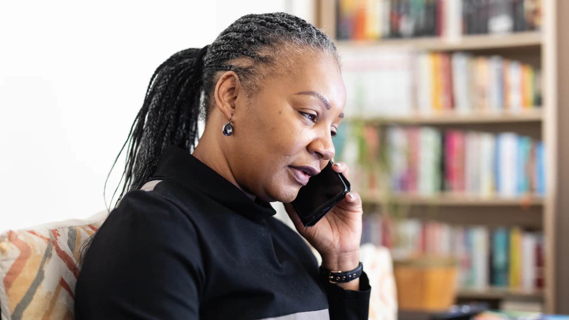 introvert woman on phone saying thanks for the invite but i've already made plans