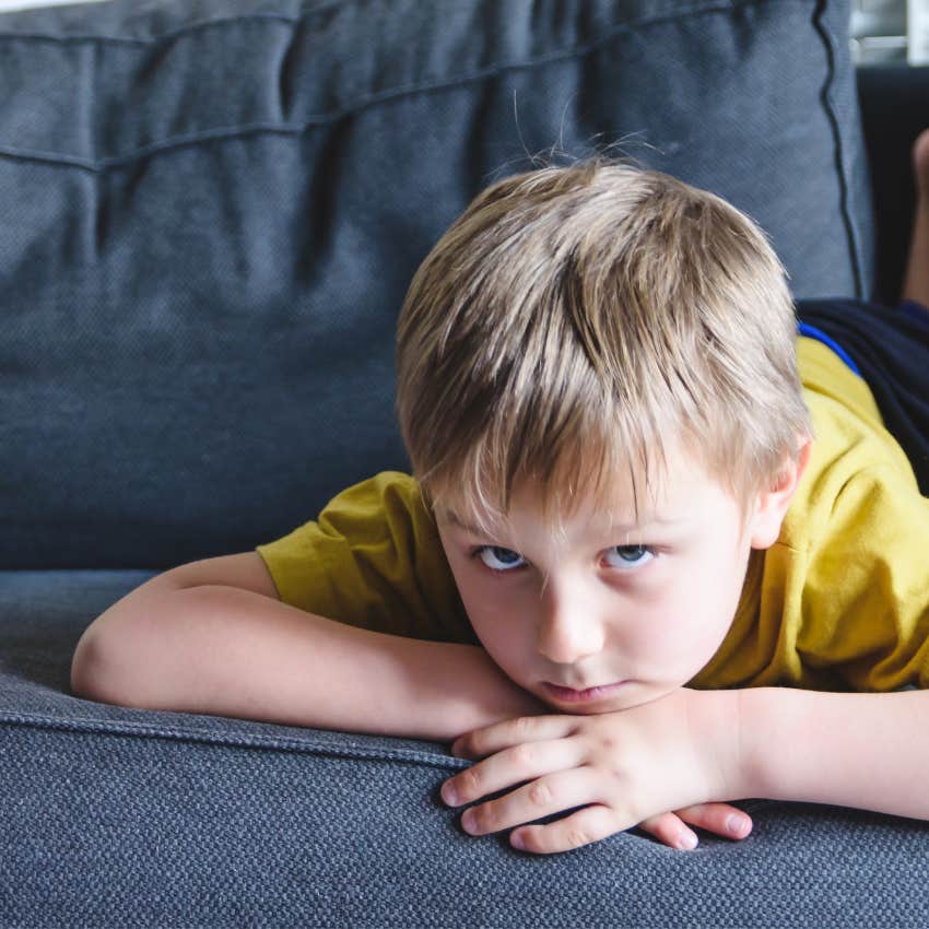 bored kid at home on the couch