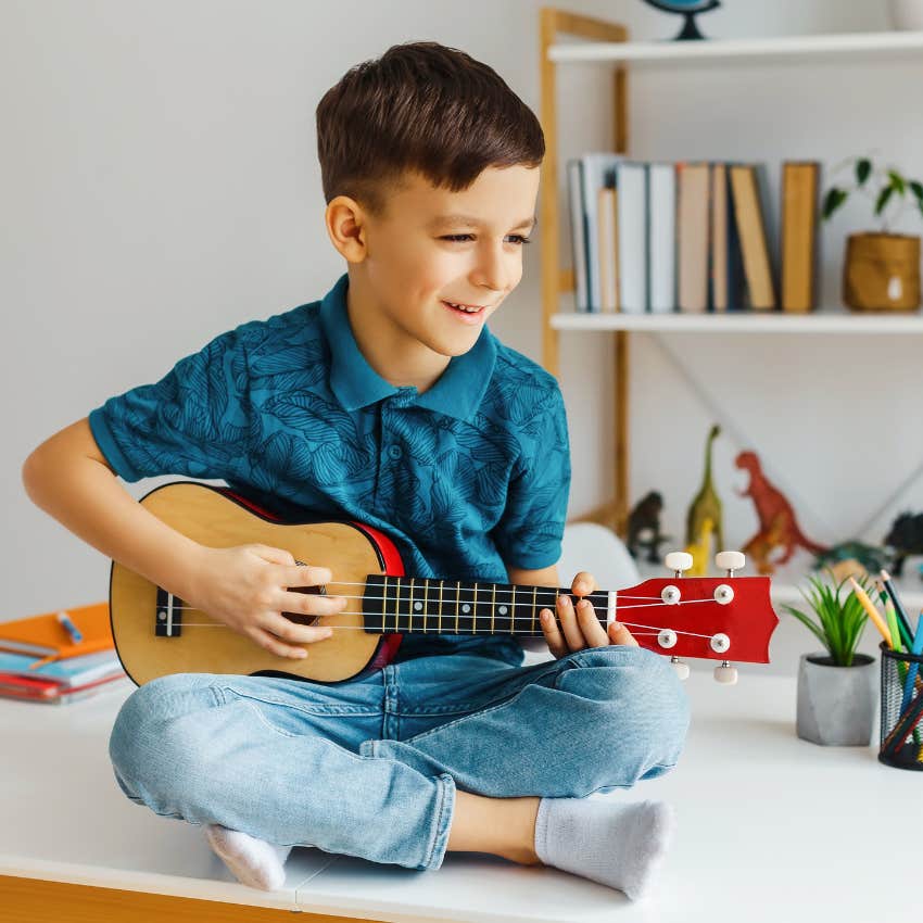 resourceful kid playing guitar