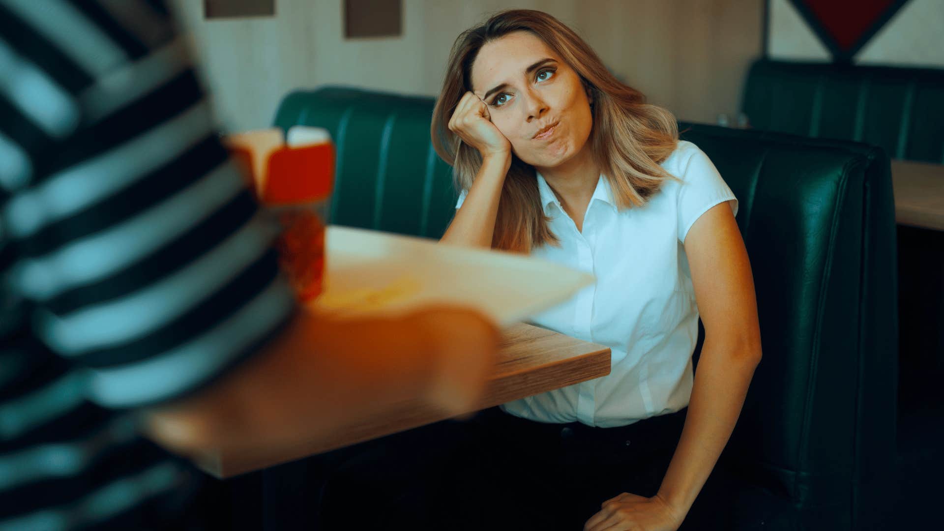 woman acting entitled as they're staring at food tray