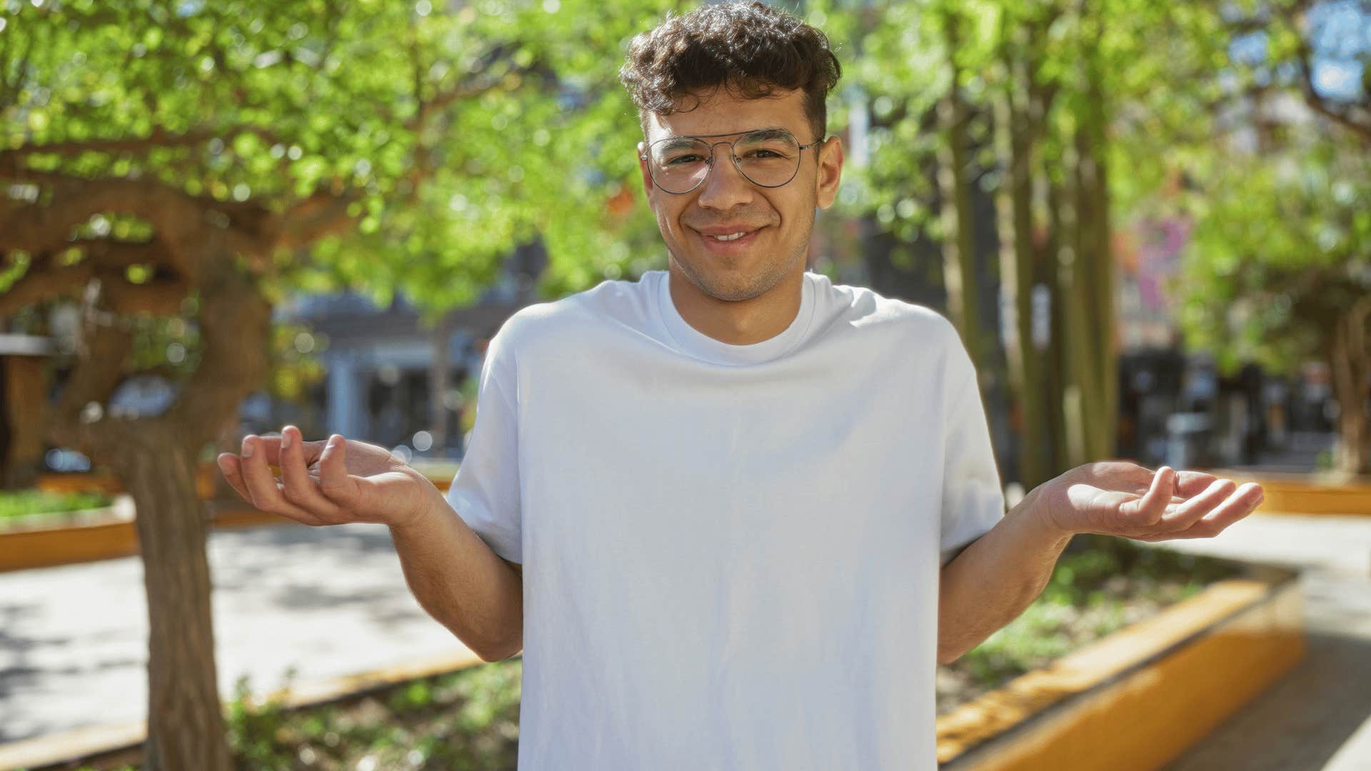 man in white shirt shrugging as they're irresponsible