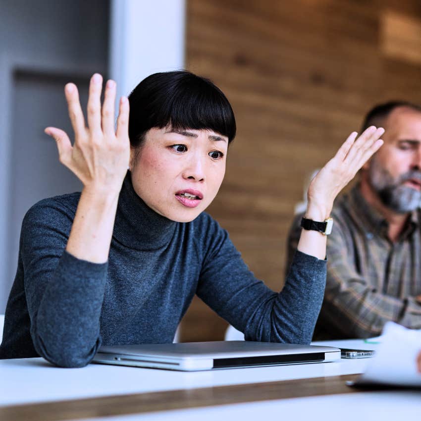 Woman who needs regular reassurance looking upset at work.