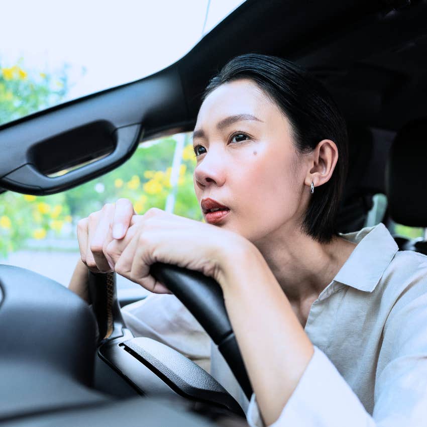 Woman showing up early and sitting in her car.
