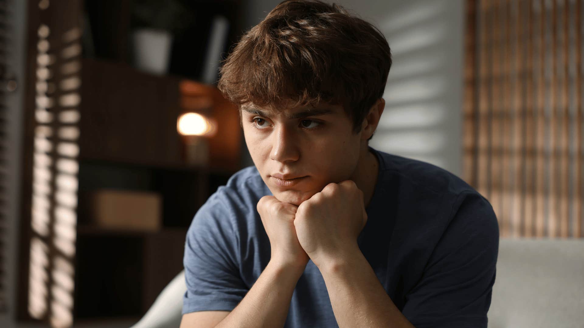 teenage boy upset as parents tell him you need to toughen up