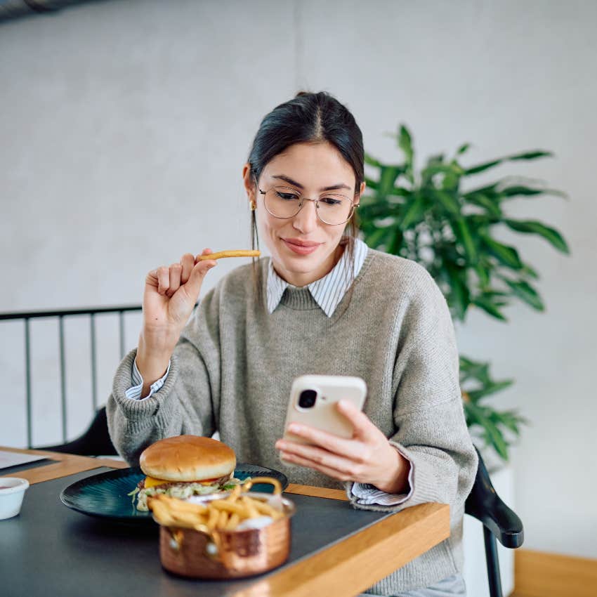 millennial woman looking at her phone