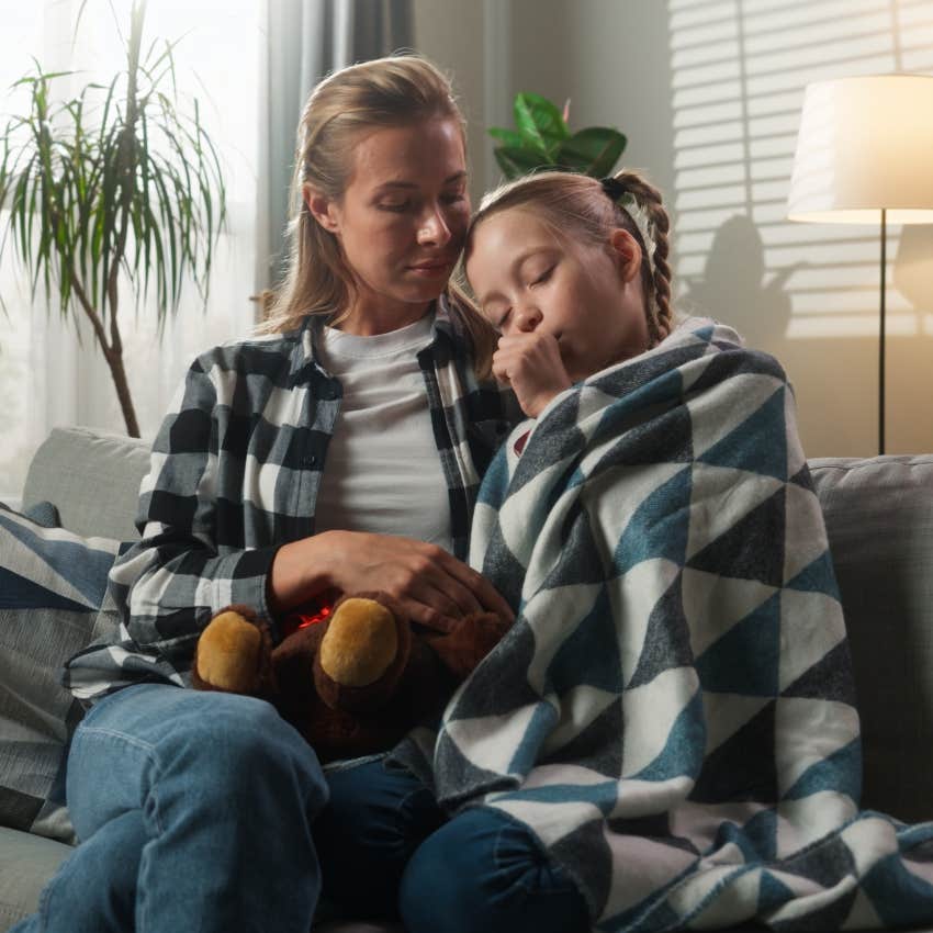 millennial mom with her sick kid