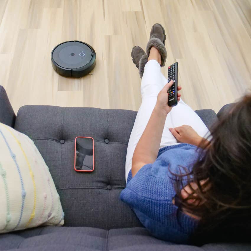 woman using smart appliances to clean