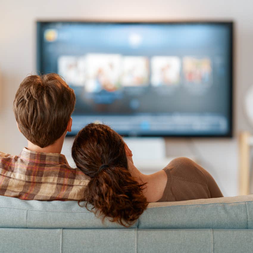 couple watching streaming services on their TV