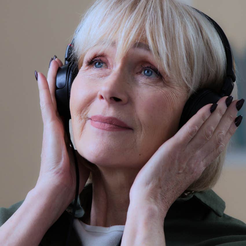 empathic woman listening to music hearing the singer's soul