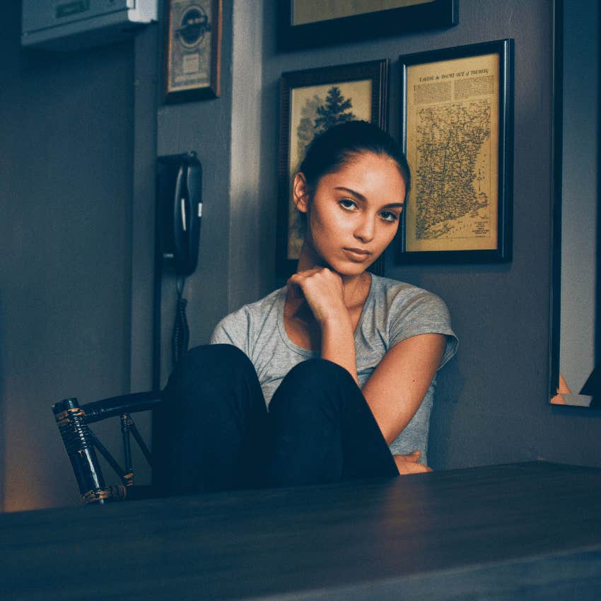 numb young woman sitting alone